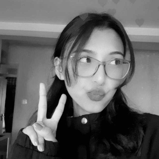 Sushila smiling and making a peace sign